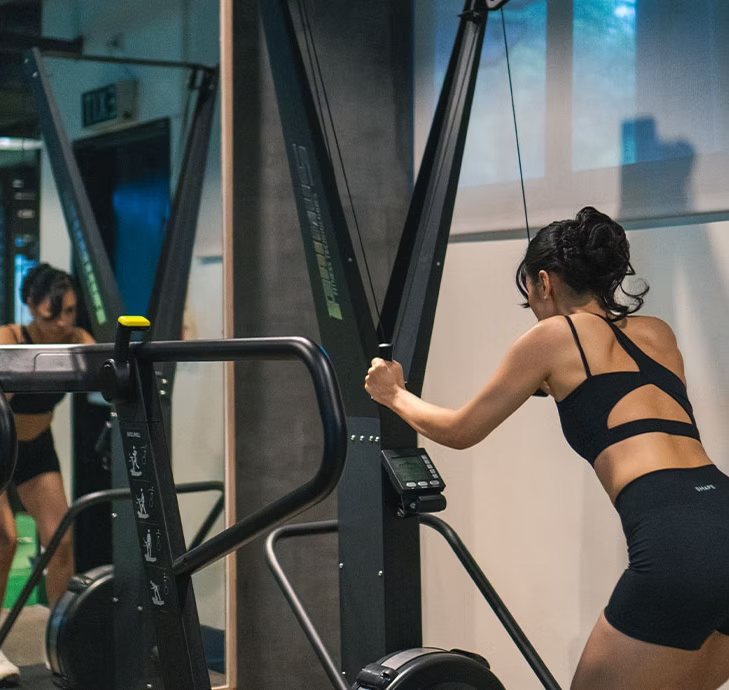A member working the ski-erg in the Functional Zone.